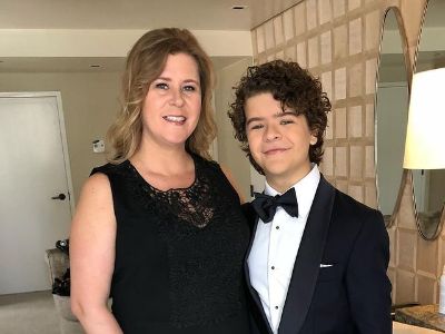 Heather Matarazzo is wearing a black dress and Gaten Matarazzo is wearing a tuxedo.